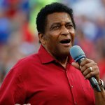 Country Music Hall of Fame member Charley Pride sings the National Anthem before the Cleveland Indians play the Texas Rangers in Arlington, Saturday, July 21, 2018.