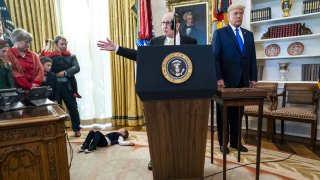 Former wrestler Dan Gable speaks before being presented the Presidential Medal of Freedom award from U.S. President Donald Trump, right, during a ceremony in the Oval Office of the White House in Washington, D.C., on Monday, Dec. 7, 2020.