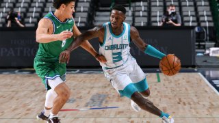 Terry Rozier #3 of the Charlotte Hornets dribbles the ball during the game against the Dallas Mavericks on December 30, 2020 at the American Airlines Center in Dallas, Texas.