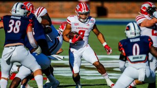 Louisiana-Lafayette Ragin Cajuns running back Trey Ragas (9) runs through the line of scrimmage during the Servpro First Responder Bowl game between the Louisiana-Lafayette Ragin Cajuns and the UTSA Roadrunners on Dec. 26, 2020 at Gerald J. Ford Stadium in Dallas, Texas.