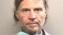 Anthony Capasso, 50, is accused of stealing a Salvation Army red kettle and threatening a security guard with a knife Monday at an Arlington Walmart, police say.