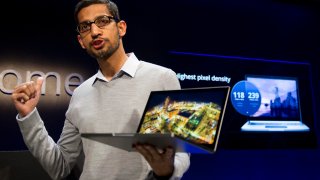 Sundar Pichai, senior vice president for Chrome at Google Inc., holds up a new Chromebook Pixel as he speaks during a launch event in San Francisco, California, U.S., on Thursday, Feb. 21, 2013. Google Inc., owner of the world’s most popular search engine, debuted a touchscreen version of the Chromebook laptop, stepping up its challenge to Microsoft Corp. and Apple Inc. in hardware.