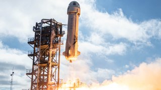 A New Shepard rocket launches on a test flight.