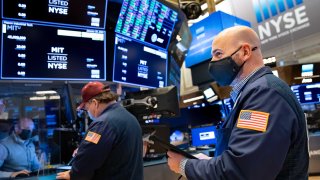 Traders work on the floor of the New York Stock Exchange.