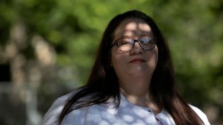 Death doula Anna Adams stands outside the Holistic Hospice Care office in San Antonio. Adams specializes in end-of-life doula care, non-medical support for the dying and their families.