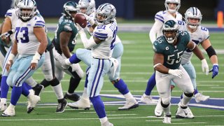 Ezekiel Elliott #21 of the Dallas Cowboys makes a catch in the first half against the Philadelphia Eagles at AT&T Stadium on Dec. 27, 2020 in Arlington, Texas.