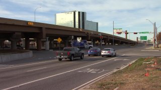 Two people were killed early Sunday when a driver ran a red light and hit their vehicle, Dallas police say.