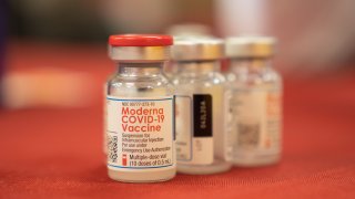 Vials of the Moderna Covid-19 vaccine at a mass vaccination super site operated by Sharp HealthCare inside a former Sears store in Chula Vista, California, U.S., on Tuesday, Jan. 26, 2021. California and other large states are loosening Covid restrictions just as scientists warn that more-contagious variants of the virus are beginning to take hold in the U.S. and the vaccine rollout struggles. Photographer: Bing Guan/Bloomberg via Getty Images