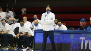 SMU Head Coach wearing a mask