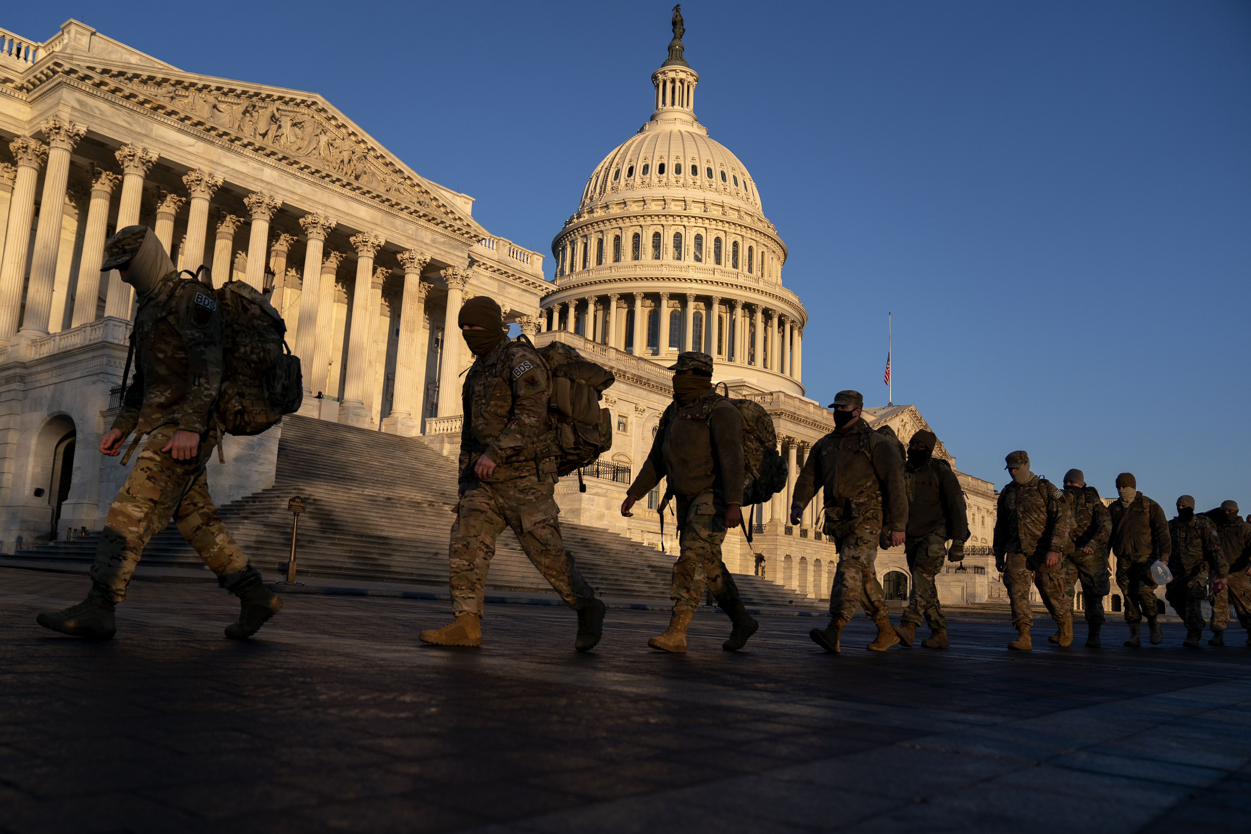 WASHINGTON, DC &#8211; JANUARY 12: Members of the National Guard gather outside the U.S. Capitol on January 12, 2021 in Washington, DC. Today the House of Representatives plans to vote on Rep. Jamie Raskin&#8217;s (D-MD) resolution calling on Vice President Mike Pence to invoke the 25th Amendment, removing President Trump from office. Wednesday, House Democrats plan on voting on articles of impeachment. (Photo by Stefani Reynolds/Getty Images)