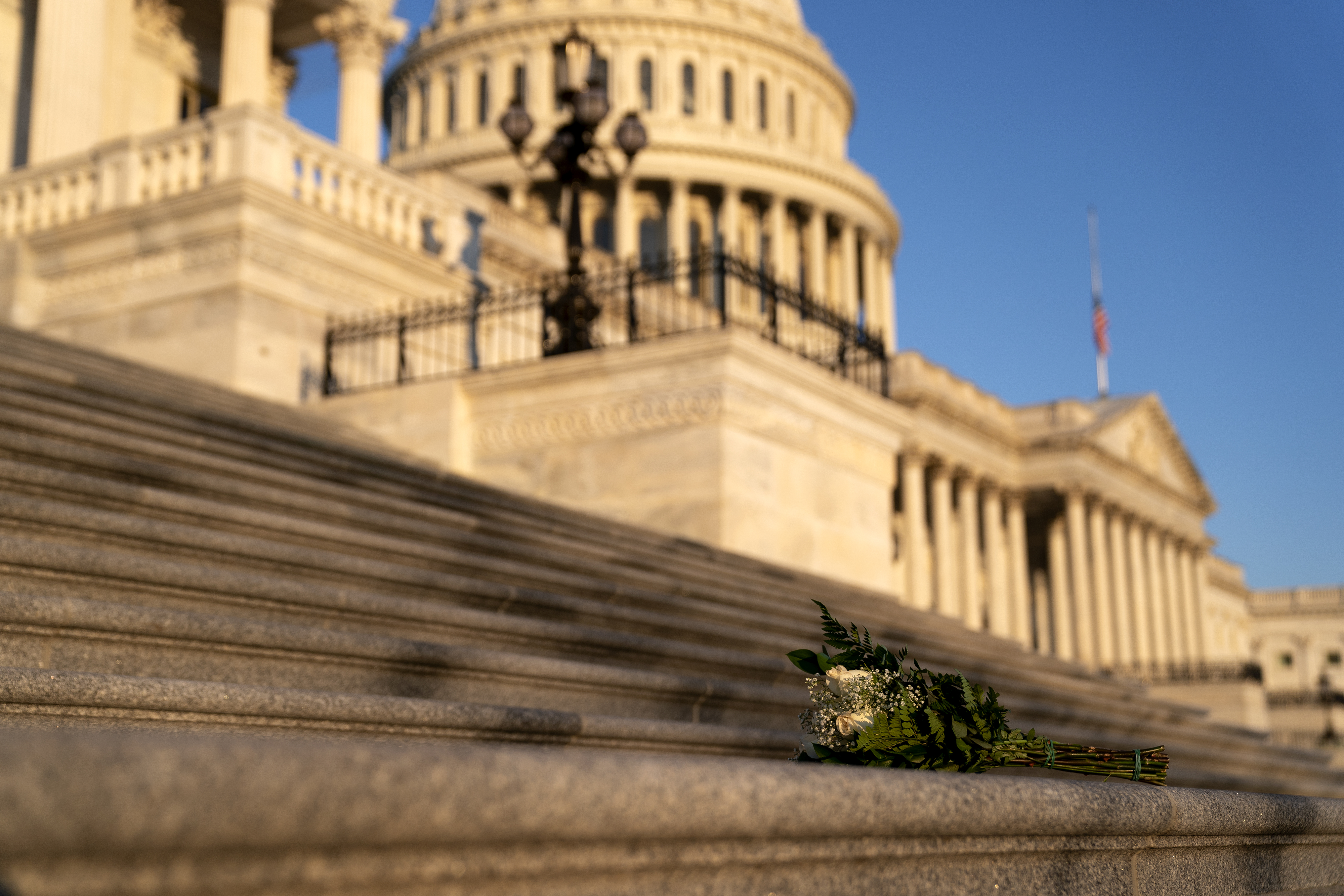 WASHINGTON, DC &#8211; JANUARY 12: Flowers lie on the House steps outside the U.S. Capitol on January 12, 2021 in Washington, DC. Today the House of Representatives plans to vote on Rep. Jamie Raskin&#8217;s (D-MD) resolution calling on Vice President Mike Pence to invoke the 25th Amendment, removing President Trump from office. Wednesday, House Democrats plan on voting on articles of impeachment. (Photo by Stefani Reynolds/Getty Images)