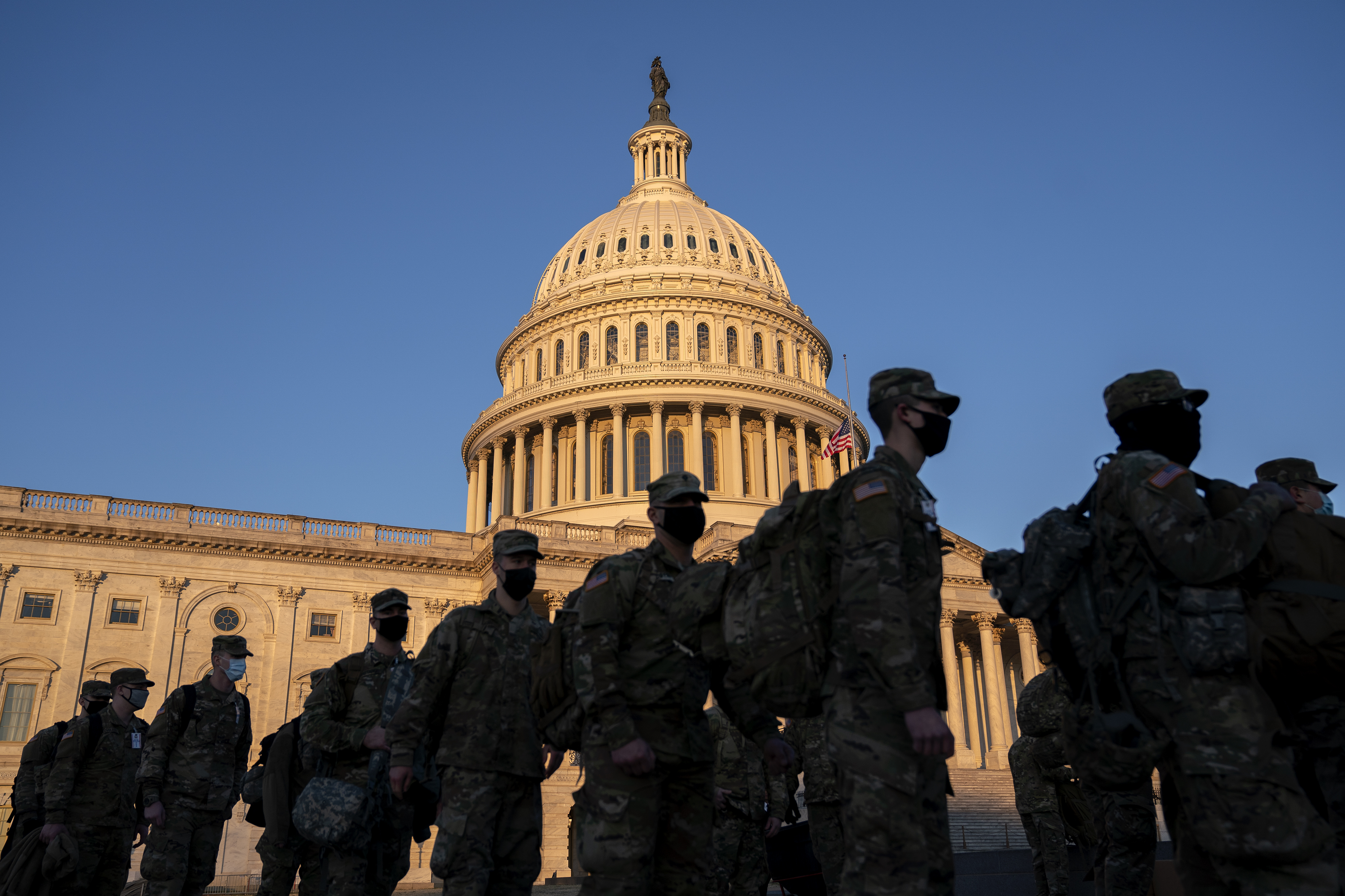 WASHINGTON, DC &#8211; JANUARY 12: Members of the National Guard gather outside the U.S. Capitol on January 12, 2021 in Washington, DC. Today the House of Representatives plans to vote on Rep. Jamie Raskin&#8217;s (D-MD) resolution calling on Vice President Mike Pence to invoke the 25th Amendment, removing President Trump from office. Wednesday, House Democrats plan on voting on articles of impeachment. (Photo by Stefani Reynolds/Getty Images)