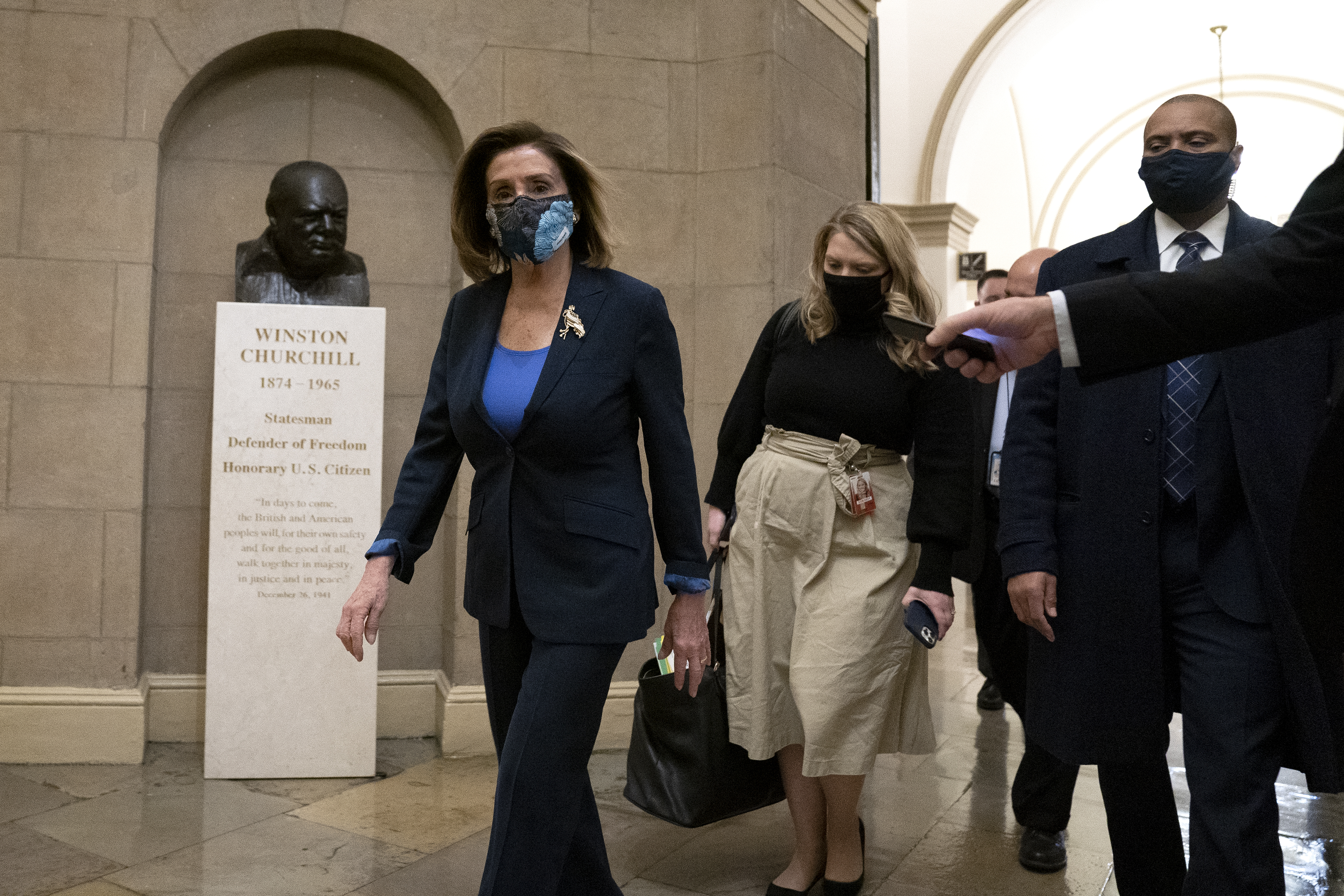 WASHINGTON, DC &#8211; JANUARY 12: Speaker of the House Nancy Pelosi (D-CA) (L) wears a protective mask while arriving to the U.S. Capitol on January 12, 2021 in Washington, DC. Today the House of Representatives plans to vote on Rep. Jamie Raskin&#8217;s (D-MD) resolution calling on Vice President Mike Pence to invoke the 25th Amendment, removing President Trump from office. On Wednesday, House Democrats plan on voting on articles of impeachment. (Photo by Stefani Reynolds/Getty Images)
