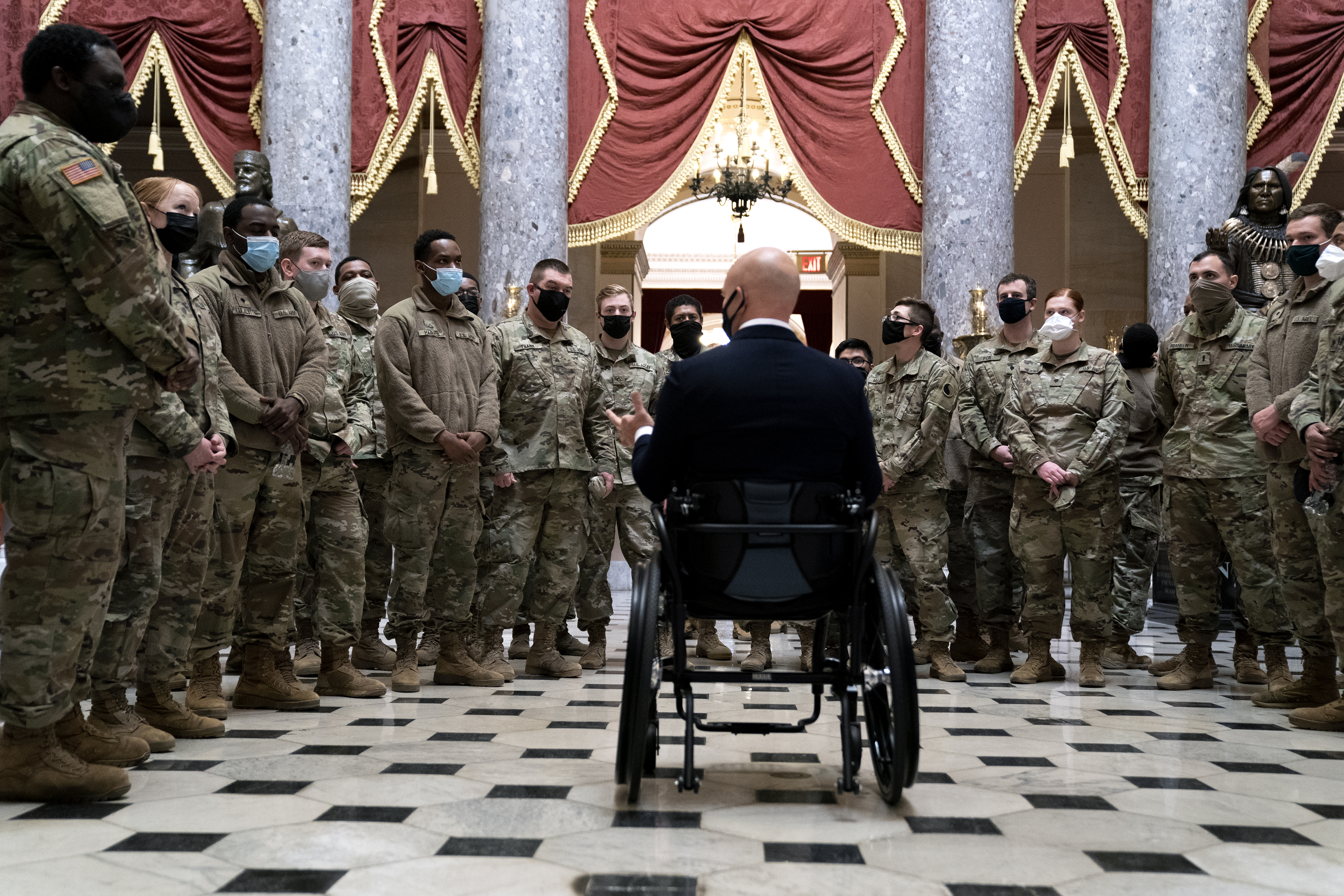 WASHINGTON, DC &#8211; JANUARY 13: Rep. Brian Mast (R-FL) (C) gives members of the National Guard a tour of the U.S. Capitol on January 13, 2021 in Washington, DC. The House of Representatives is expected to vote to impeach President Donald Trump later today, after Vice President Mike Pence declined to use the 25th amendment to remove him from office after protestors breached the U.S. Capitol last week. (Photo by Stefani Reynolds/Getty Images)