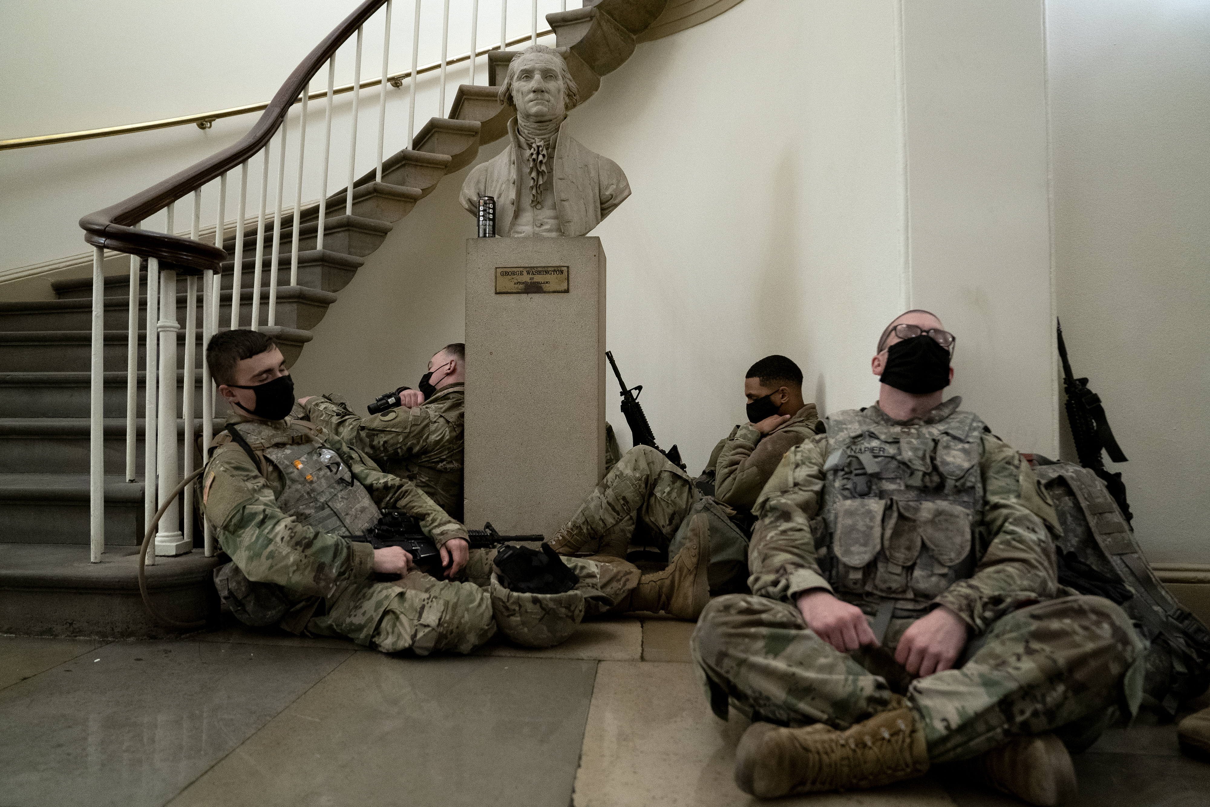 WASHINGTON, DC &#8211; JANUARY 13: Members of the National Guard rest in the U.S. Capitol on January 13, 2021 in Washington, DC. Security has been increased throughout Washington following the breach of the U.S. Capitol last Wednesday, and leading up to the Presidential inauguration. (Photo by Stefani Reynolds/Getty Images)
