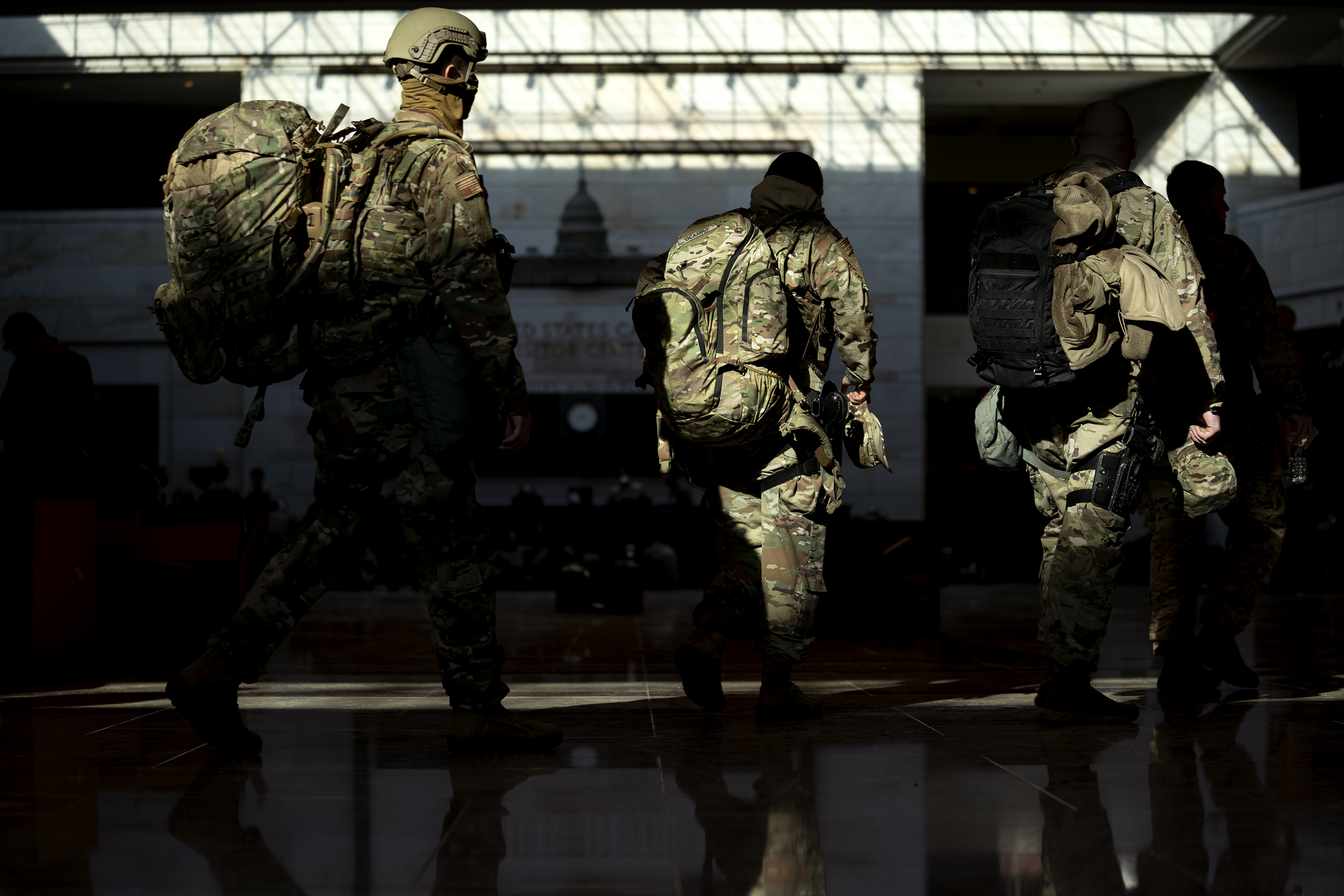 WASHINGTON, DC &#8211; JANUARY 13: Members of the National Guard walk through the Visitor Center of the U.S. Capitol on January 13, 2021 in Washington, DC. Security has been increased throughout Washington following the breach of the U.S. Capitol last Wednesday, and leading up to the Presidential inauguration. (Photo by Stefani Reynolds/Getty Images)