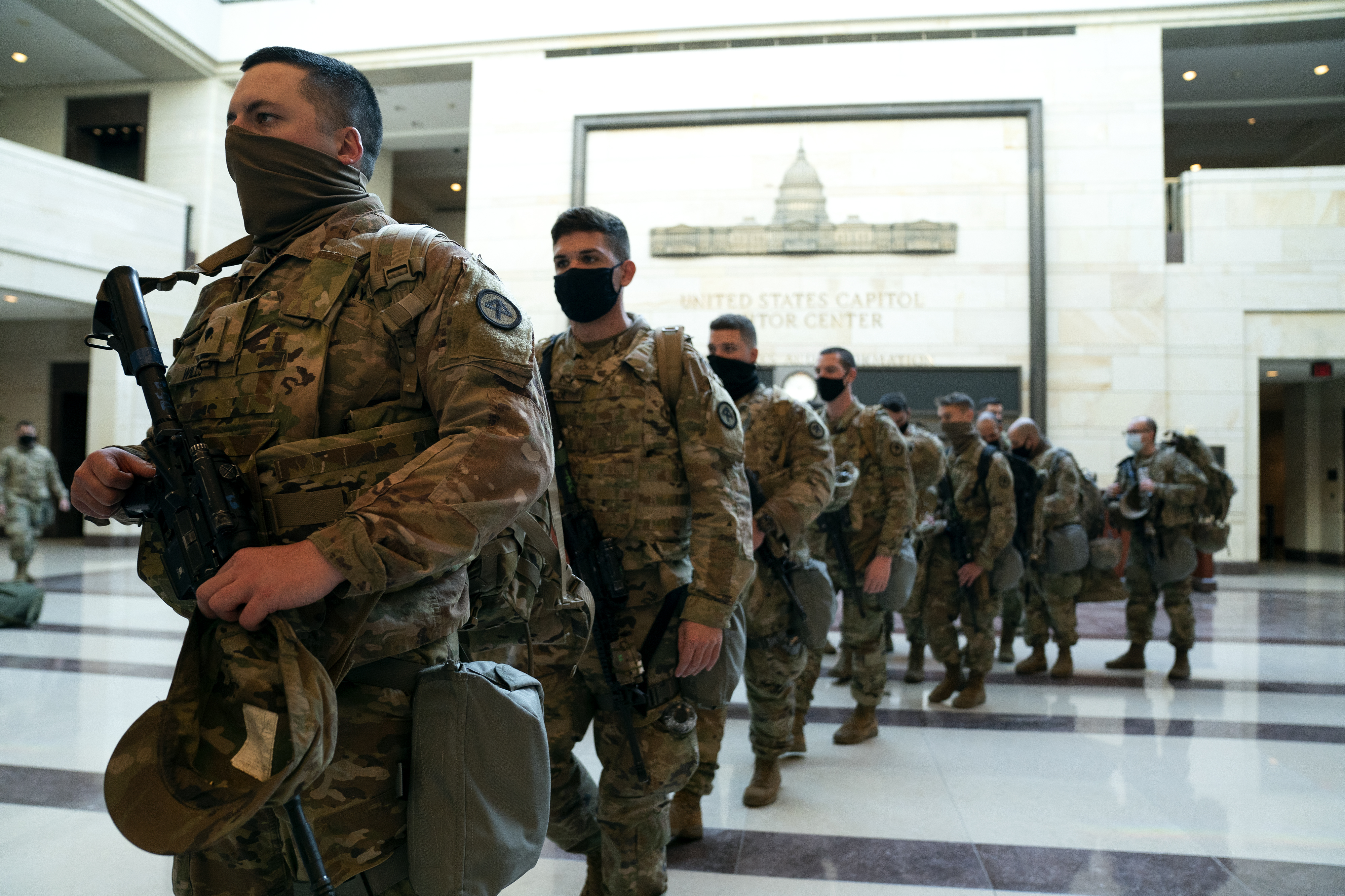 WASHINGTON, DC &#8211; JANUARY 13: Members of the National Guard walk through the Visitor Center of the U.S. Capitol on January 13, 2021 in Washington, DC. Security has been increased throughout Washington following the breach of the U.S. Capitol last Wednesday, and leading up to the Presidential inauguration. (Photo by Stefani Reynolds/Getty Images)