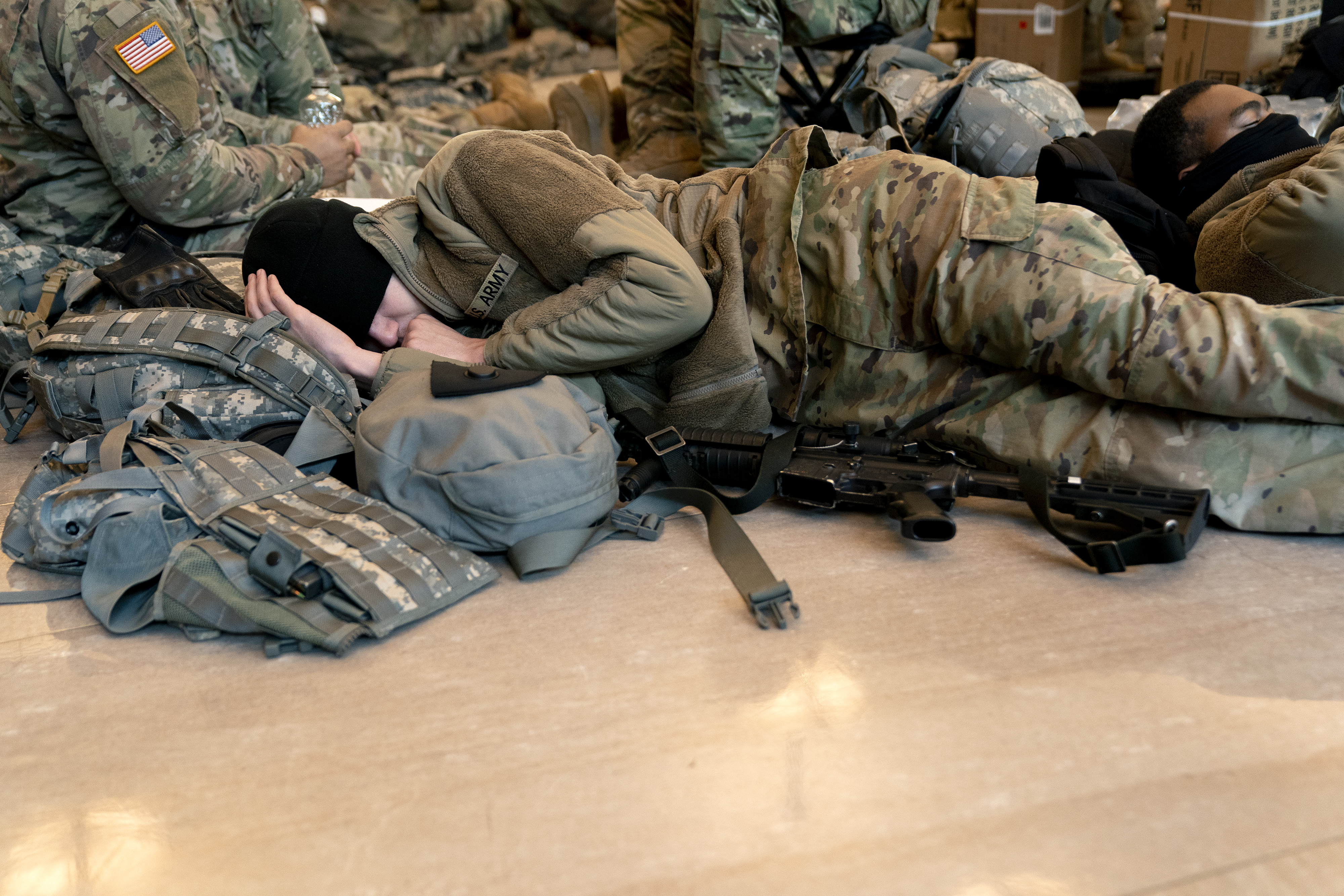 WASHINGTON, DC &#8211; JANUARY 13: A member of the National Guard sleeps in the Visitor Center of the U.S. Capitol on January 13, 2021 in Washington, DC. Security has been increased throughout Washington following the breach of the U.S. Capitol last Wednesday, and leading up to the Presidential inauguration. (Photo by Stefani Reynolds/Getty Images)