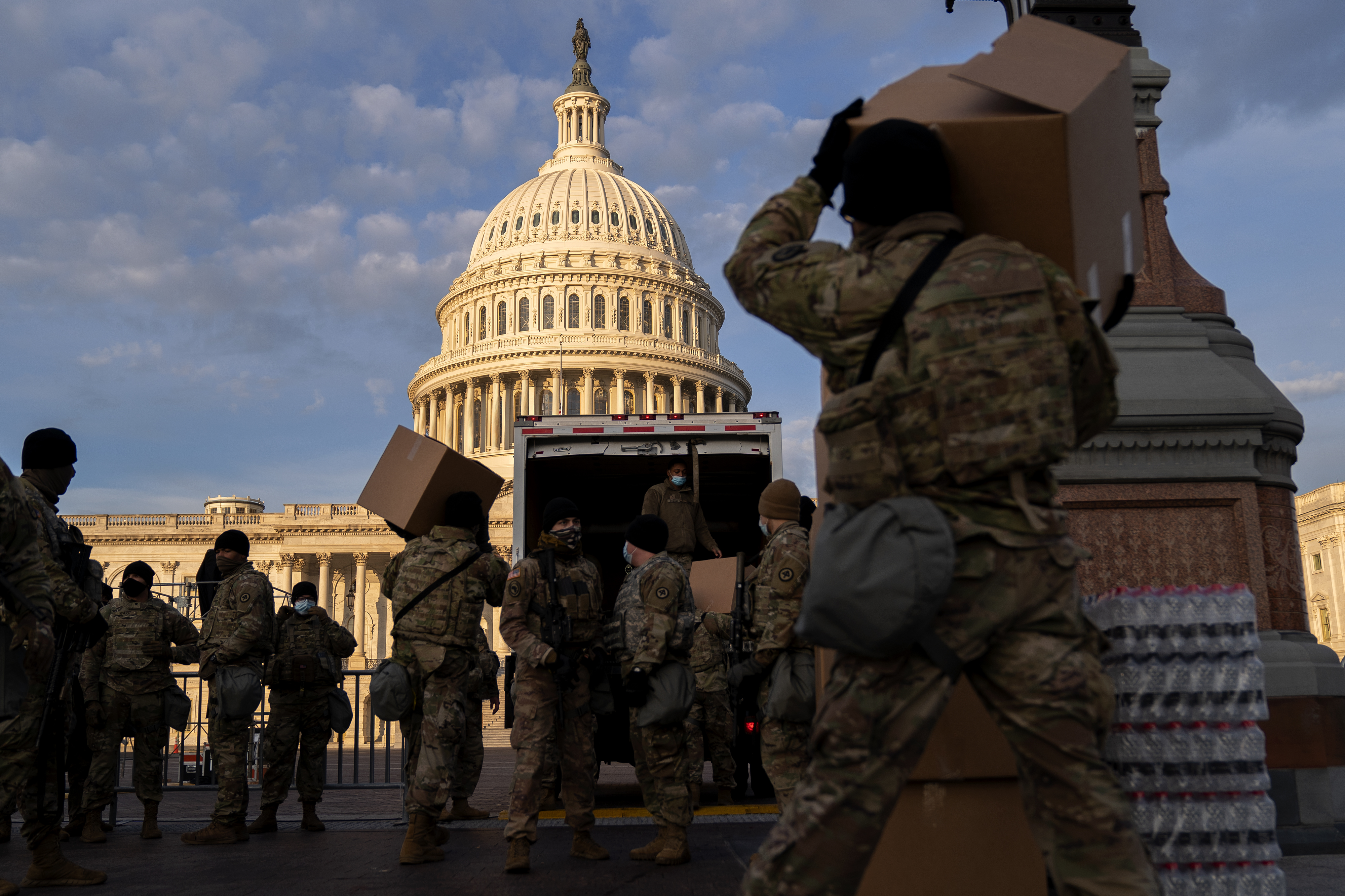 WASHINGTON, DC &#8211; JANUARY 14: Members of the National Guard unload supplies outside the U.S. Capitol on January 14, 2021 in Washington, DC. Security has been increased throughout Washington following the breach of the U.S. Capitol last Wednesday, and leading up to the Presidential Inauguration. (Photo by Stefani Reynolds/Getty Images)