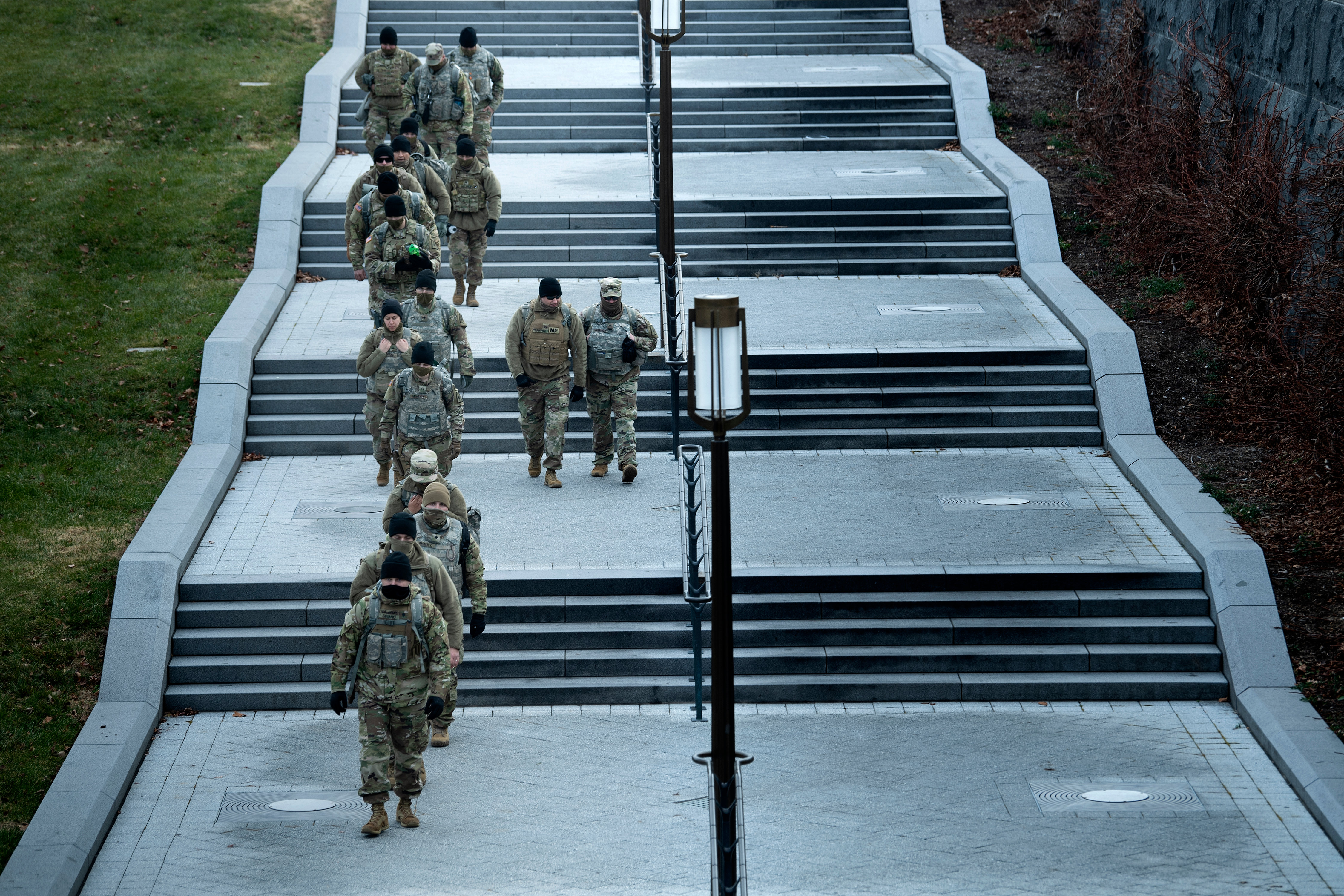 Members of the Nation Guard patrol Capitol Hill on January 14, 2021, in Washington, DC, a week after supporters of US President Donald Trump attacked the US Capitol, and ahead of the inauguration of President-elect Joe Biden on January 20. (Photo by Brendan Smialowski / AFP)