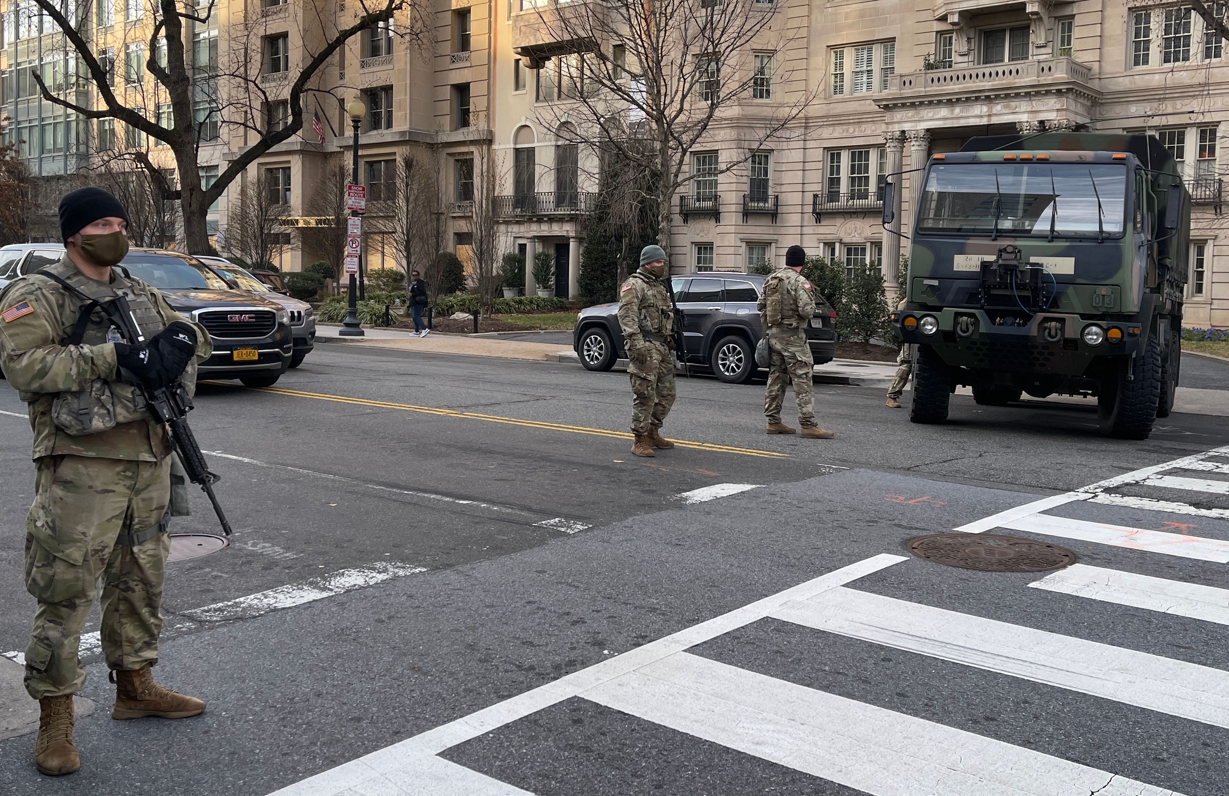US National Guard soldiers patrol a street near the White House in Washington, DC, on January 15, 2021, five days before the inauguration of US President-elect Joe Biden. (Photo by Daniel SLIM / AFP)