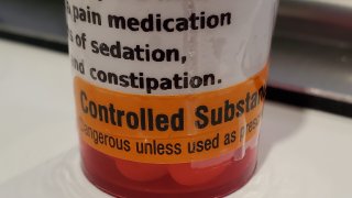 Close-up of a pain medication bottle featuring the warning “Controlled substance, December 26, 2020. Dangerous if not used as prescribed” in Lafayette, California.