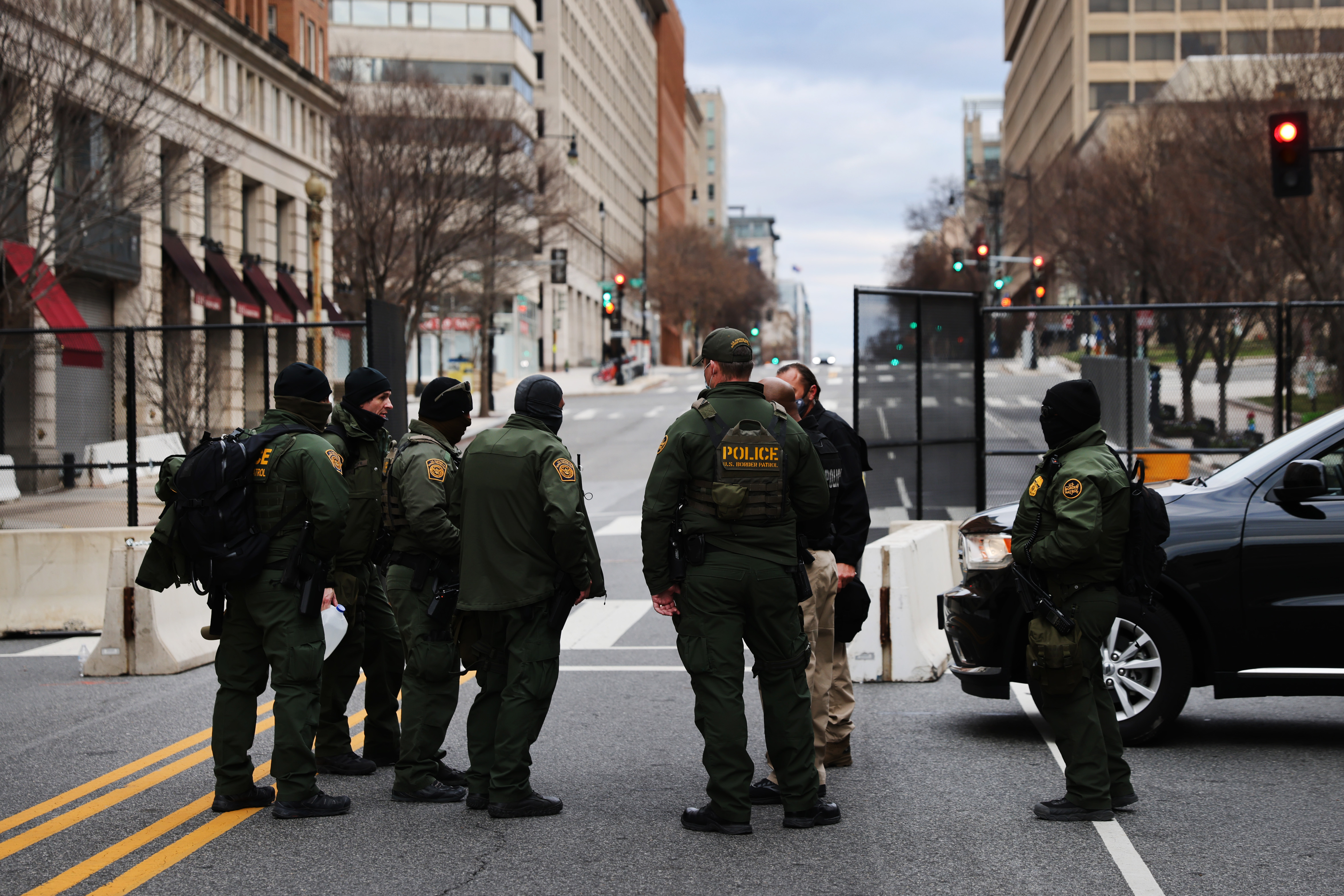 WASHINGTON, DC &#8211; JANUARY 17: Law enforcement stand at a road block on January 17, 2021 in Washington, DC. The National Guard is expected to deploy more than 20,000 troops in and around the Capitol and many area businesses will remain closed for the period leading up to the January 20th inauguration of Joseph Biden as president. While there have been no specific threats to the Capitol, online extremist chatter has indicated that some people remain committed to disrupting events and protesting the election results. (Photo by Spencer Platt/Getty Images