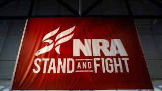 A National Rifle Association (NRA) banner is displayed during the organization's Annual Meetings & Exhibits at the George R. Brown Convention Center in Houston, Texas, U.S., on Saturday, May 4, 2013.