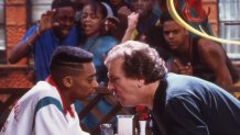 Portrait of American film director and actor Spike Lee (left) and actor Danny Aiello on the set of their film 'Do the Right Thing' (directed by Lee), New York, 1989. Other cast members look in through a window behind them.. (Photo by Anthony Barboza/Getty Images)