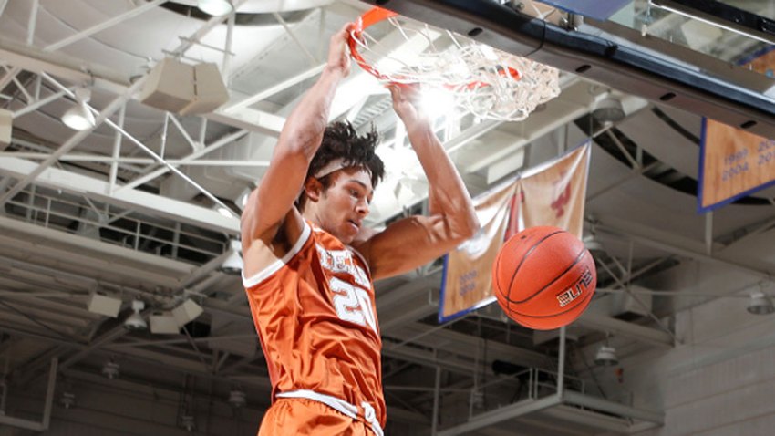 Texas Longhorns forward Jericho Sims (20) dunks against the Davidson Wildcats during the first half of the first round of the Camping World Maui Invitational on Nov. 30, 2020, at the Harrah's Cherokee Center in Asheville, North Carolina.