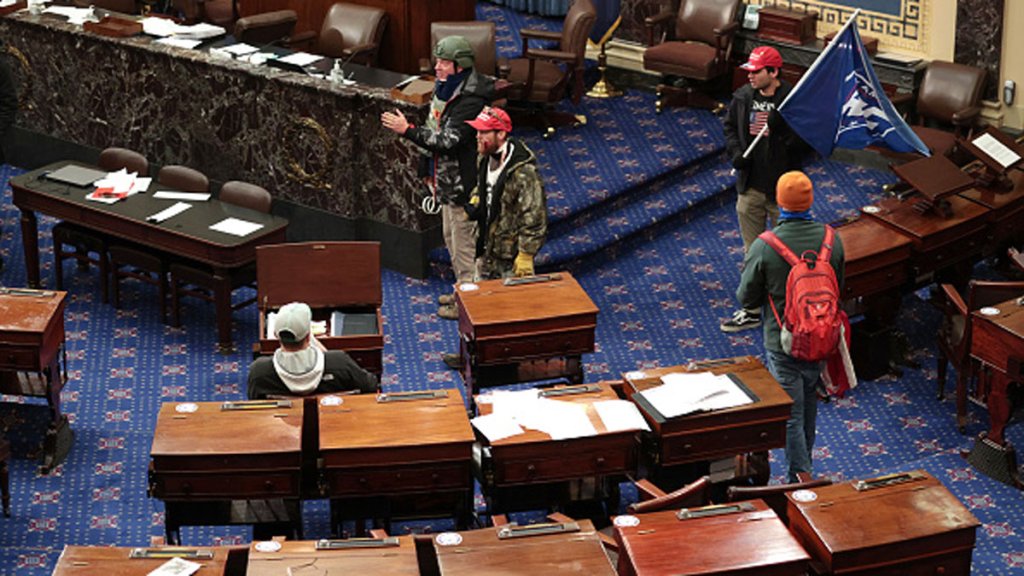 Larry Rendell Brock of Grapevine confirmed to The New Yorker Saturday that this photo shows him in the Senate Chamber on Jan. 6, 2021 in Washington, DC. Brock is pictured in combat gear in the top left portion of the photo.