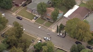 Dallas police investigate the location where James Faith was shot and called on Waverly Drive on Oct. 9, 2020.