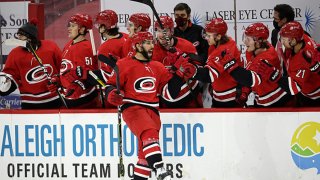 Vincent Trocheck #16 of the Carolina Hurricanes celebrates his shootout goal with teammates on the bench during an NHL game against the Dallas Stars on Jan. 31, 2021 at PNC Arena in Raleigh, North Carolina.