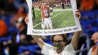 A Texas Longhorns fan holds a sign for Sam Ehlinger #11 during the Valero Alamo Bowl against the Colorado Buffaloes at the Alamodome on Dec. 29, 2020 in San Antonio, Texas.