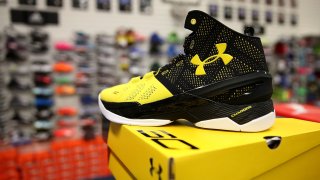 Under Armour sports shoes on display.