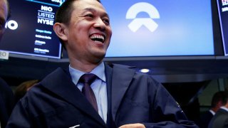 Bin Li, CEO of Chinese electric vehicle start-up NIO Inc., celebrates after ringing a bell as NIO stock begins trading on the floor of the New York Stock Exchange (NYSE) during the company’s initial public offering (IPO) at the NYSE in New York, September 12, 2018.
