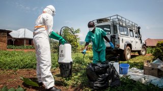 World Health Organization workers decontaminate the house of a pastor who has just tested positive for Ebola in Beni, June 13, 2019.