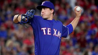 Derek Holland #45 of the Texas Rangers pitches against the Tampa Bay Rays in the top of the eighth inning at Globe Life Park in Arlington on Oct. 1, 2016 in Arlington, Texas.