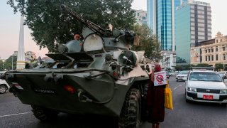 In this Feb. 14, 2021, file photo, an armored vehicle drives past the Sule Pagoda, following days of mass protests against the military coup, in Yangon, Myanmar.