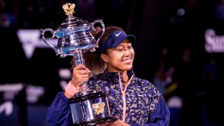 Naomi Osaka of Japan holds her trophy after winning the Women's Singles Final of the 2021 Australian Open on February 20 2021, at Melbourne Park in Melbourne, Australia.