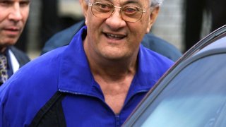 UNITED STATES - JUNE 04: Peter Gotti, brother of jailed mob boss John Gotti, is led out of the Waterfront Commission by police after being arrested along with 16 other alleged members of the Gambino crime family. They were later indicted on charges related to illegal activities along the waterfront.