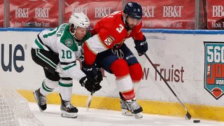 Ty Dellandrea #10 of the Dallas Stars defends against Keith Yandle #3 of the Florida Panthers as he circles behind the net with the puck during first period action at the BB&T Center on Feb. 22, 2021 in Sunrise, Florida.