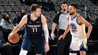 Luka Doncic #77 of the Dallas Mavericks dribbles the ball against Andrew Wiggins #22 of the Golden State Warriors on Feb. 6, 2021 at the American Airlines Center in Dallas, Texas.