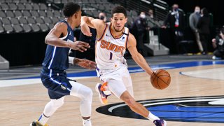 Devin Booker #1 of the Phoenix Suns handles the ball during the game against the Dallas Mavericks on Feb. 1, 2021 at the American Airlines Center in Dallas, Texas.