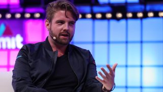 Blockchain co-founder and CEO Peter Smith speaks during the Web Summit tech conference in Lisbon, Portugal on November 6, 2018.
