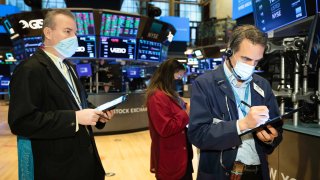 Traders work on the floor of the New York Stock Exchange.