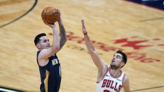 New Orleans Pelicans guard JJ Redick shoots next to Chicago Bulls guard Tomas Satoransky (31) during the first half of an NBA basketball game in New Orleans, Wednesday, March 3, 2021.