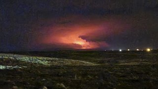 The night sky glows following the eruption of a volcano on Iceland's Reykjanes Peninsula not far from the capital Reykjavik, late Friday March 19, 2021. The long dormant volcano on the Reykjanes Peninsula in southwestern Iceland flared to life Friday night, spilling lava down two sides in that area's first volcanic eruption in nearly 800 years.