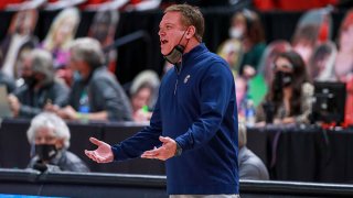 FILE: Head coach Bill Self of the Kansas Jayhawks talks with a player during the first half of the college basketball game against the Texas Tech Red Raiders at United Supermarkets Arena on Dec. 17, 2020 in Lubbock, Texas.