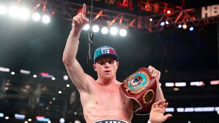 Canelo Alvarez celebrates after knocking out Liam Smith, lower, during the WBO Junior Middleweight World fight at AT&T Stadium on Sept. 17, 2016 in Arlington, Texas.